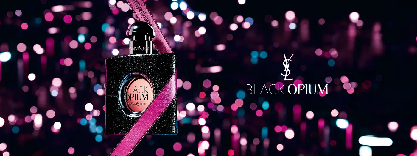 Flakon vor buntem Hintergrund