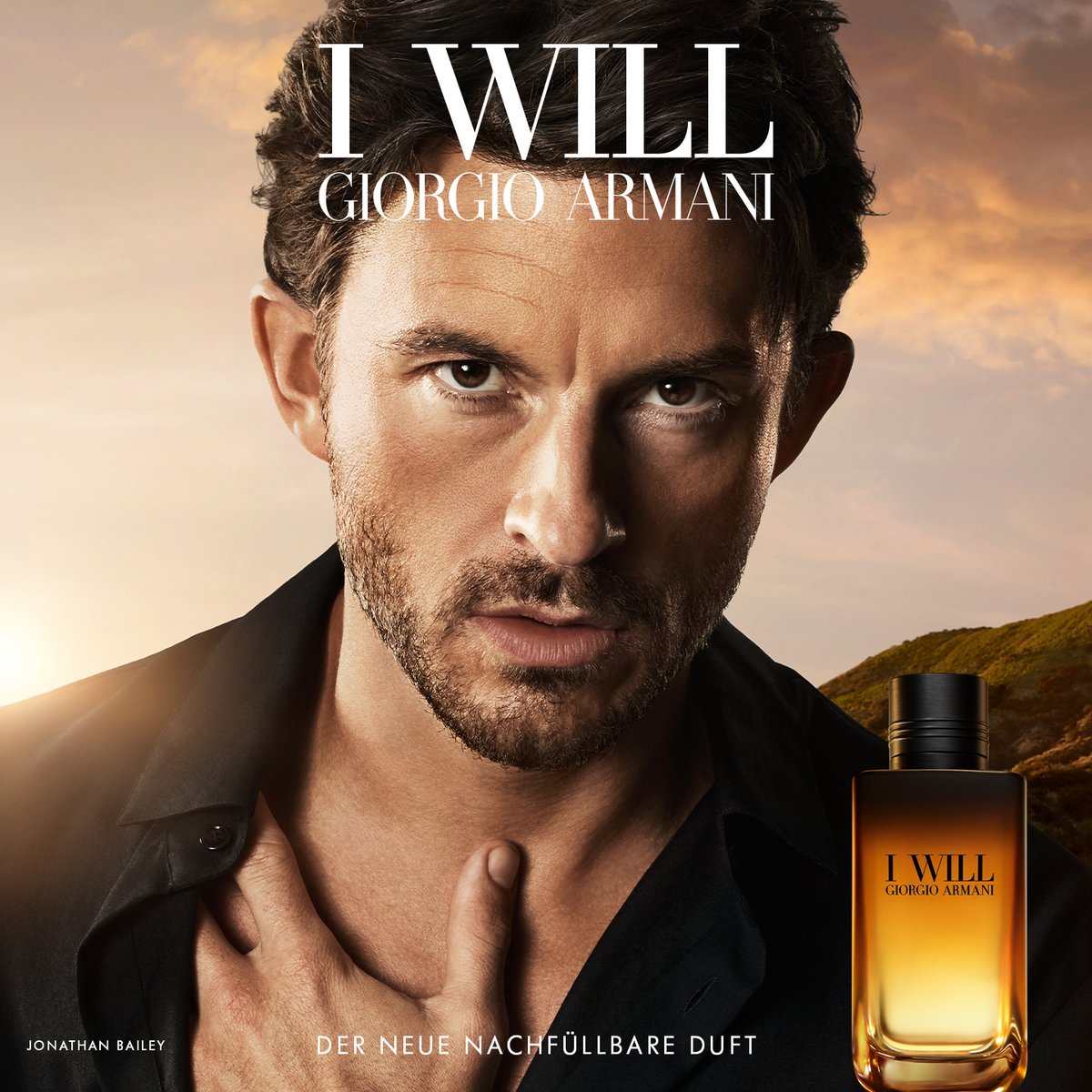 Giorgio Armani 'I Will' Parfüm-Kampagne mit Jonathan Bailey vor Sonnenuntergangs-Landschaft, daneben der Flakon des neuen nachfüllbaren Duftes
