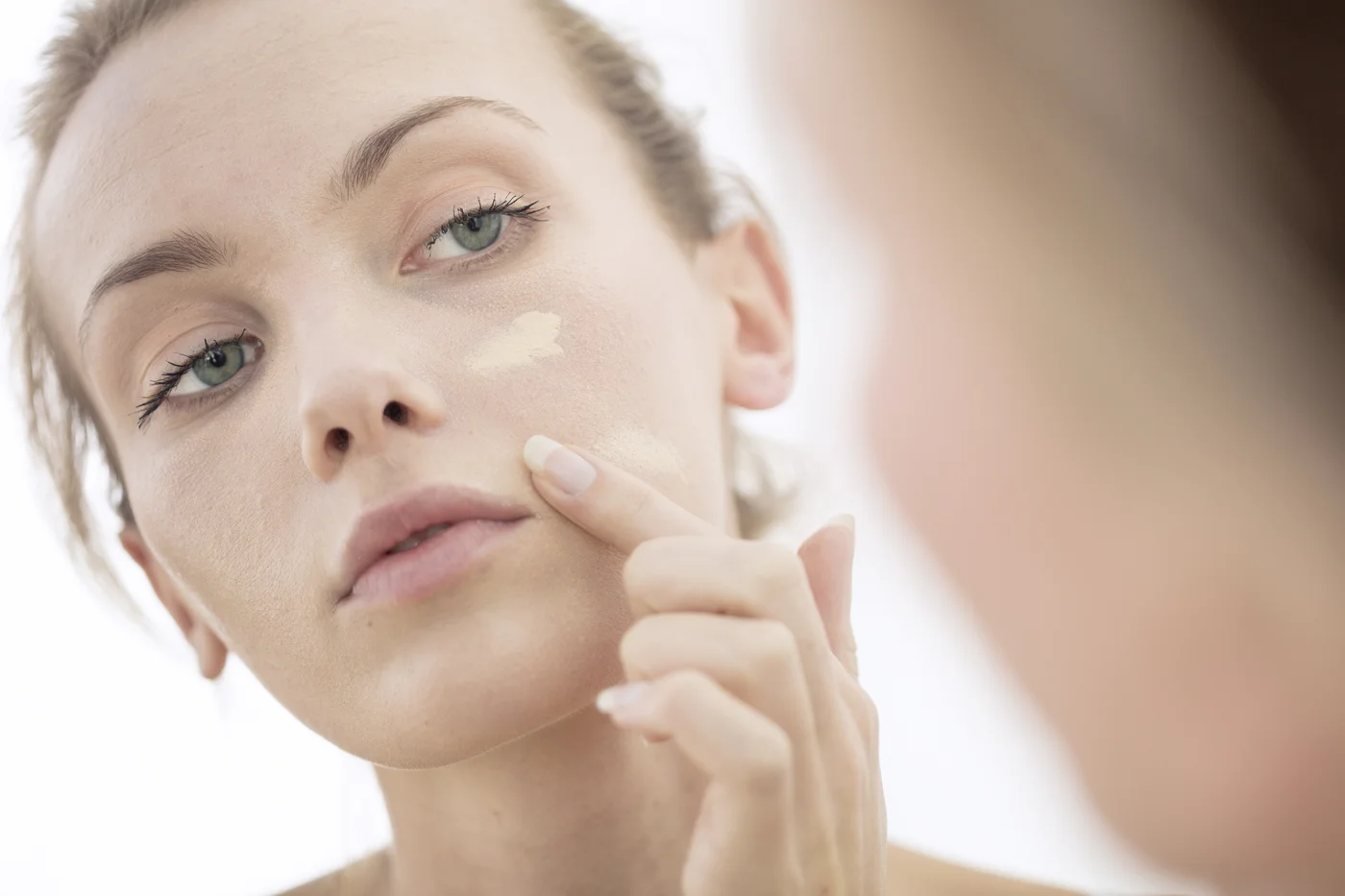 Woman applying Foudation