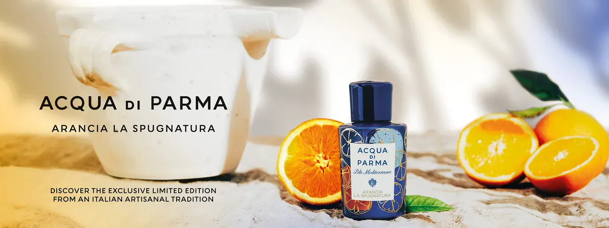 Acqua di Parma Flakon im Fokus, dekoriert mit Orangen 