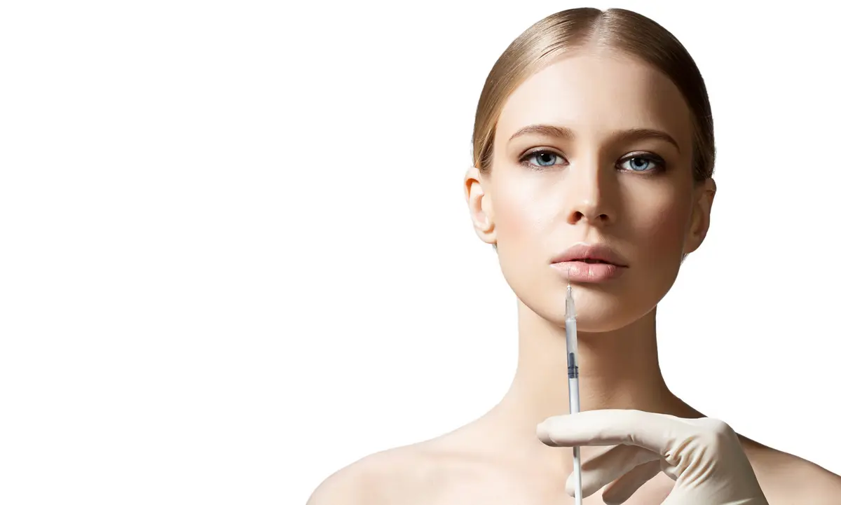 Frau mit Injektionsnadel